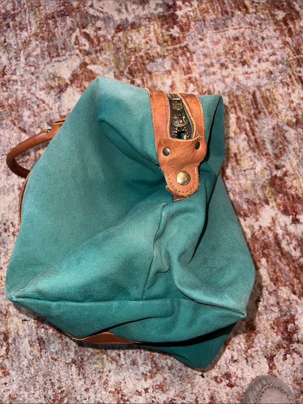 Vintage green duffle bag with leather handles